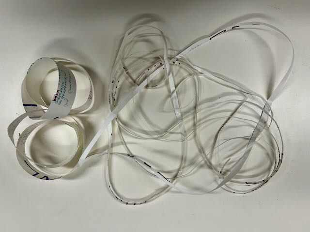 Two Möbius strips, one cut open into a single long loop